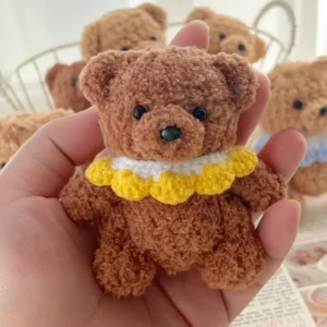 Handmade knitted teddy bear plush toy with soft yarn texture, crafted for comfort and gentle companionship.